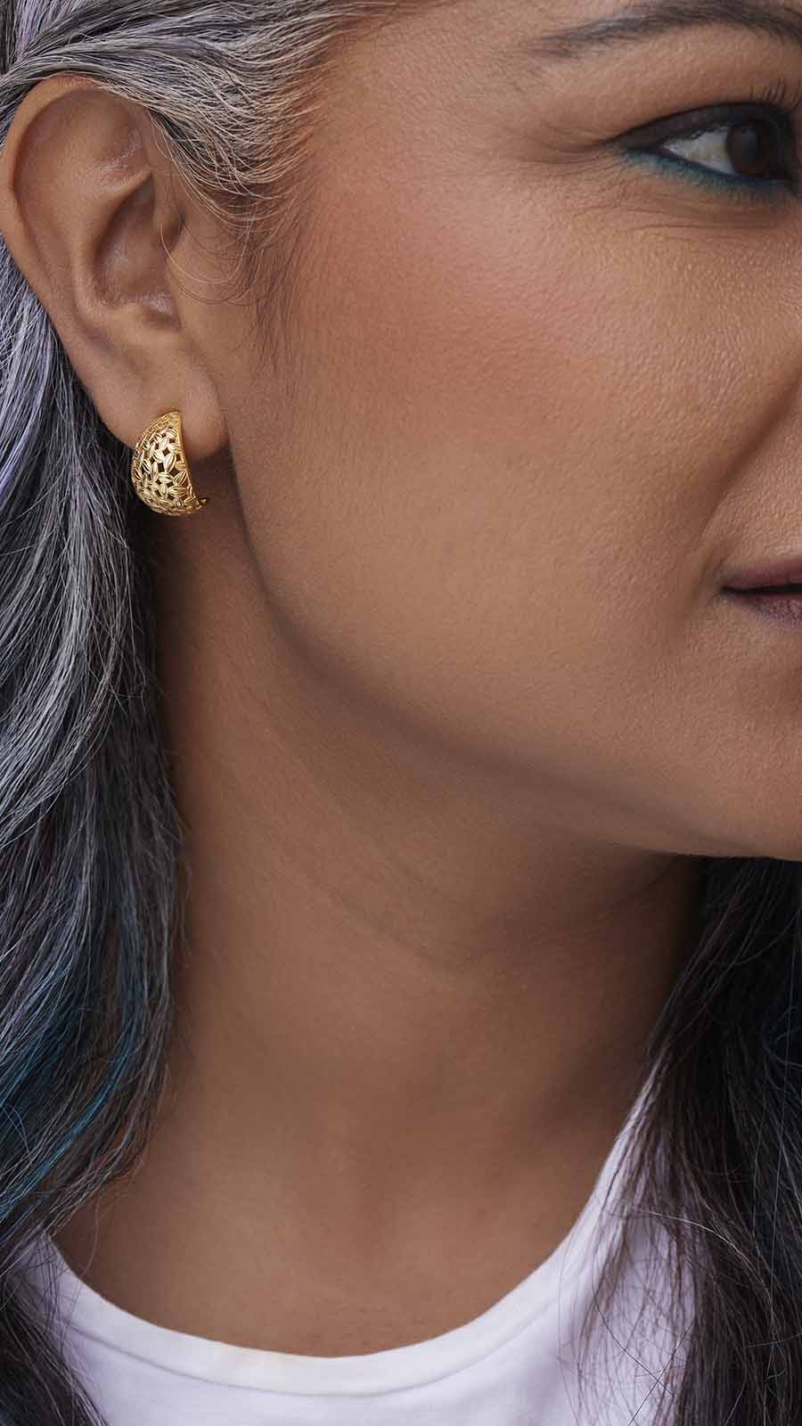 Zoomed picture of an Indian working woman wearing hope earrings