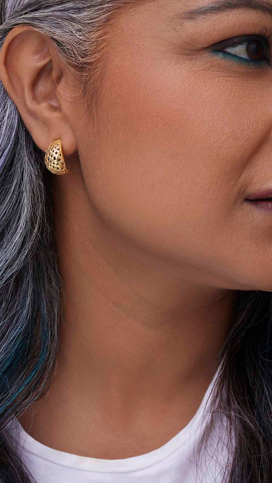 Zoomed picture of an Indian working woman wearing hope earrings